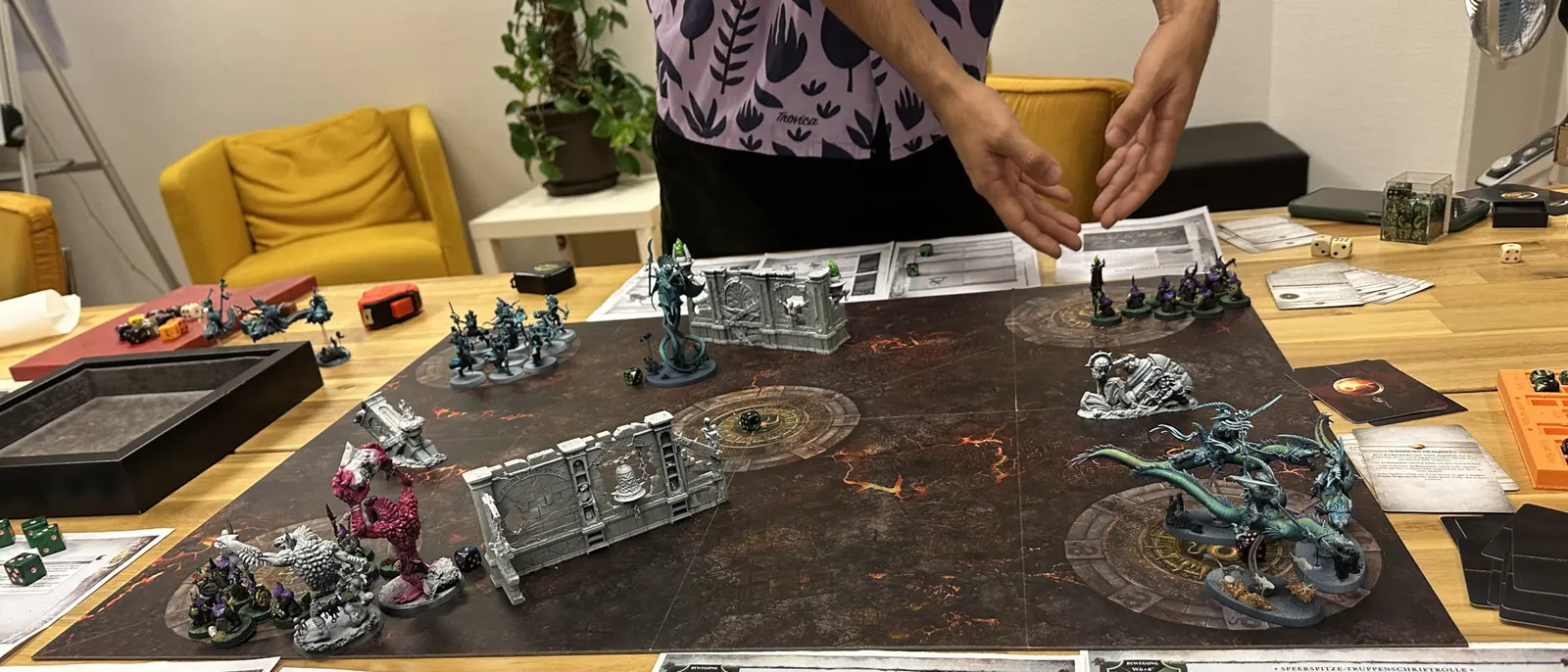 A skirmish wargame set up mid-battle on the table, painted armies facing off