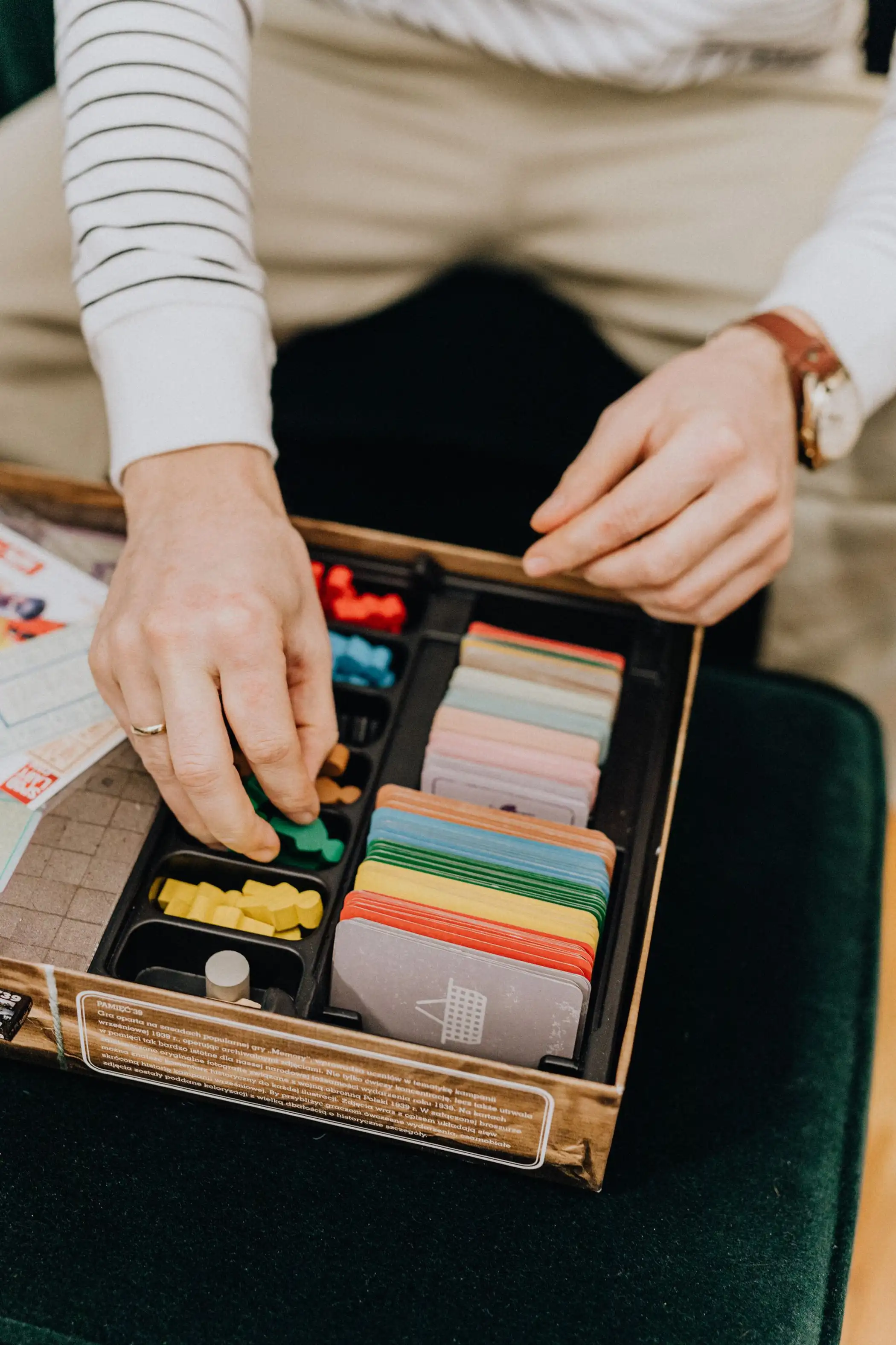 Hands setting up a board game